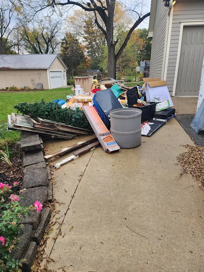 Dumpster being loaded with debris for Demolition Dumpster Rental in Monticello